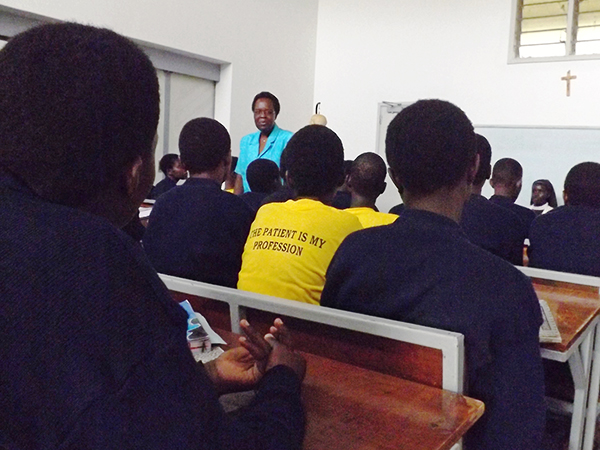 student wearing shirt with school motto